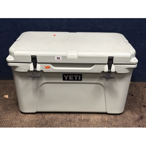 59 - A YETI 45 DUCK EGG HARD SHELL COOLER, with two baskets and ice packs, condition report: light scuffs... 