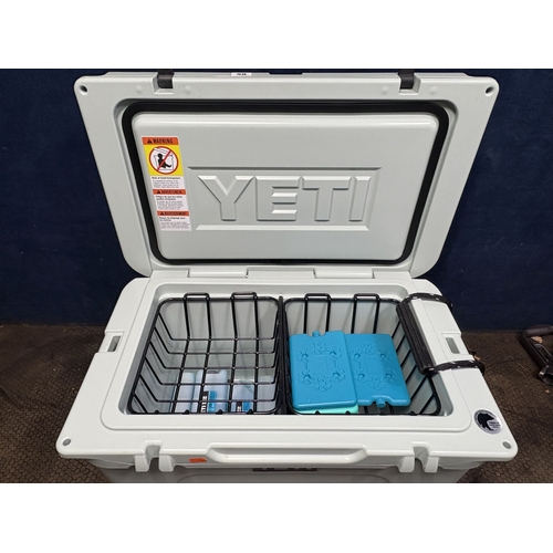 59 - A YETI 45 DUCK EGG HARD SHELL COOLER, with two baskets and ice packs, condition report: light scuffs... 