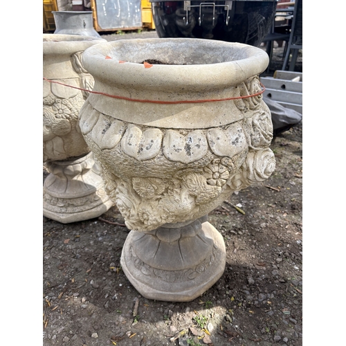 6 - A PAIR OF WEATHERED CONCRETE GARDEN URNS, decorated with roses and fruiting vines, diameter 47cm x h... 