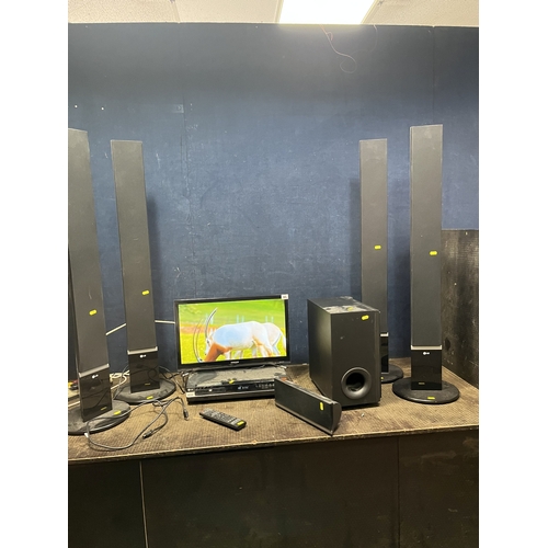 65 - A SAMSUNG UE22H5600 22in SMART TV without a remote and an LG home theatre system, including a DVD pl... 