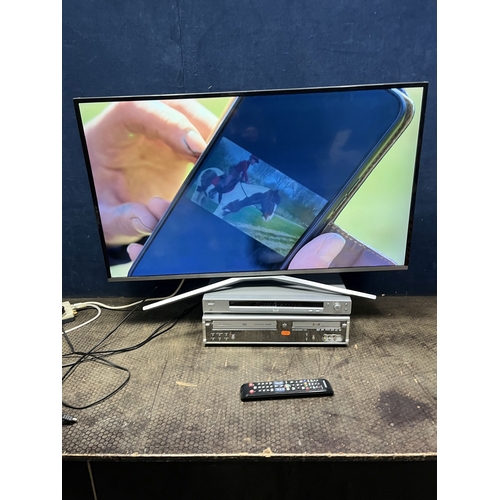 66 - A SAMSUNG UE40KU6400 40in SMART TV with remote (PAT pass and working), a Daewoo VHD/DVD player and a... 