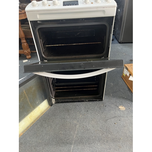 69 - A ZANUSSI ELECTRIC COOKER with a glass four-ring hob, grill and oven, width 55cm, depth 63cm, height... 