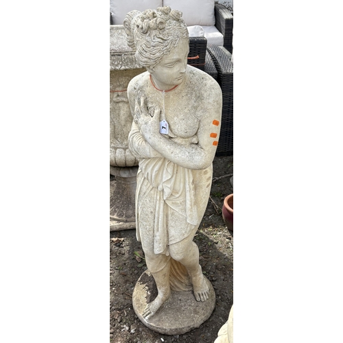 7 - A WEATHERED CONCRETE GARDEN STATUE, of a Gracian semi-clad lady, height 116cm, condition report: no ... 