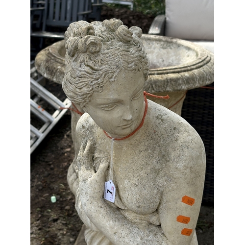 7 - A WEATHERED CONCRETE GARDEN STATUE, of a Gracian semi-clad lady, height 116cm, condition report: no ... 