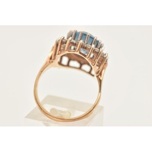 401 - A 9CT GOLD SYNTHETIC SPINEL CLUSTER RING, of an oval form, set with a central light blue oval cut st... 