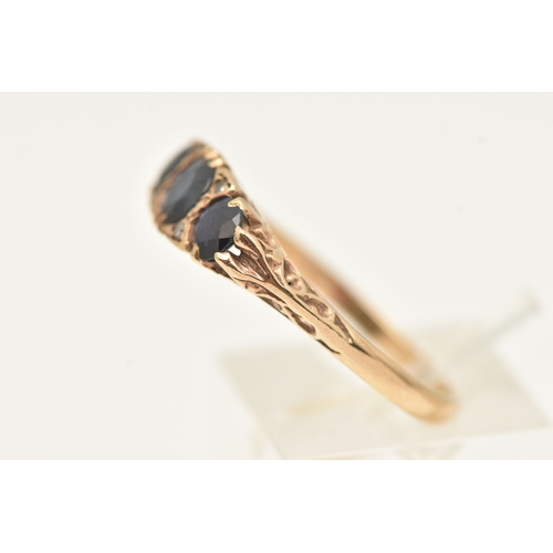403 - A 9CT GOLD SAPPHIRE AND DIAMOND RING, set with three circular cut blue sapphires interspaced with fo... 