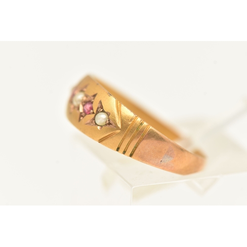 417 - A 9CT YELLOW GOLD GEM SET BAND RING, set with seed pearls and red paste, approximate width 5mm, hall... 