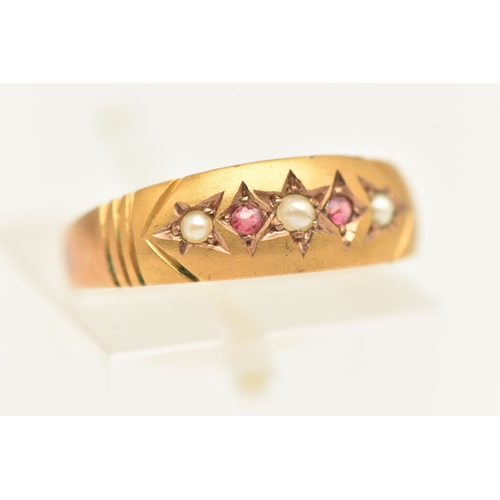 417 - A 9CT YELLOW GOLD GEM SET BAND RING, set with seed pearls and red paste, approximate width 5mm, hall... 