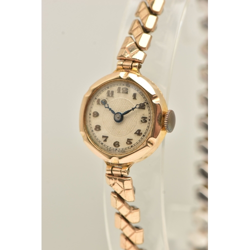 479 - A LADIES BOXED 9CT GOLD CASED WRISTWATCH, manual wind, round silvered Arabic numeral dial, blue stee... 