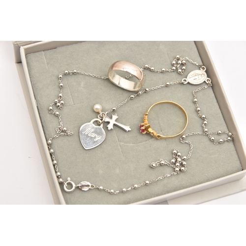 483 - A SMALL ASSORTMENT OF JEWLLERY, to include a continental yellow metal ring set with a ruby and two c... 