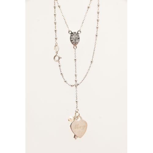 483 - A SMALL ASSORTMENT OF JEWLLERY, to include a continental yellow metal ring set with a ruby and two c... 