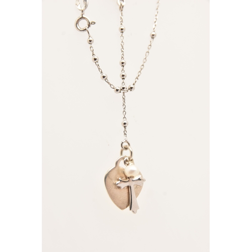 483 - A SMALL ASSORTMENT OF JEWLLERY, to include a continental yellow metal ring set with a ruby and two c... 