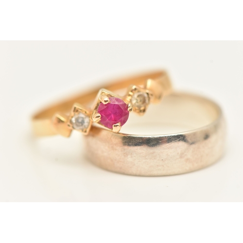 483 - A SMALL ASSORTMENT OF JEWLLERY, to include a continental yellow metal ring set with a ruby and two c... 