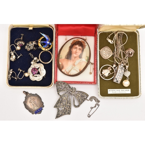 512 - AN ASSORTMENT OF SILVER AND WHITE METAL JEWELLERY, to include a silver and marcasite bow brooch, a s... 