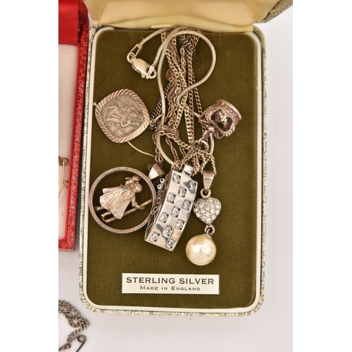 512 - AN ASSORTMENT OF SILVER AND WHITE METAL JEWELLERY, to include a silver and marcasite bow brooch, a s... 