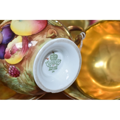 796 - A GROUP OF SEVEN PIECES OF AYNSLEY 'ORCHARD GOLD' FINE CHINA, comprising two plates, featuring the h... 