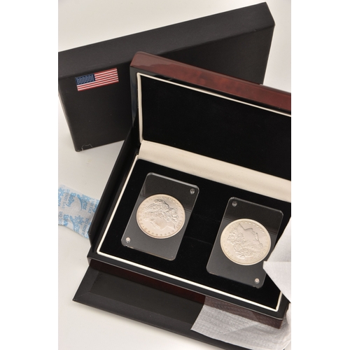 614 - A BOXED FIRST AND LAST AMERICAN SILVER DOLLAR, dates for 1878 and 1921, both in protective cases, wo... 