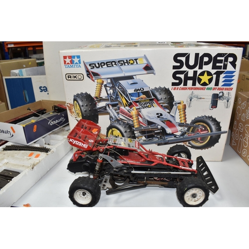 947 - THREE BOXES AND LOOSE REMOTE CONTROL CARS AND TRAINS to include a Kyosho 1:10 scale off road racing ... 