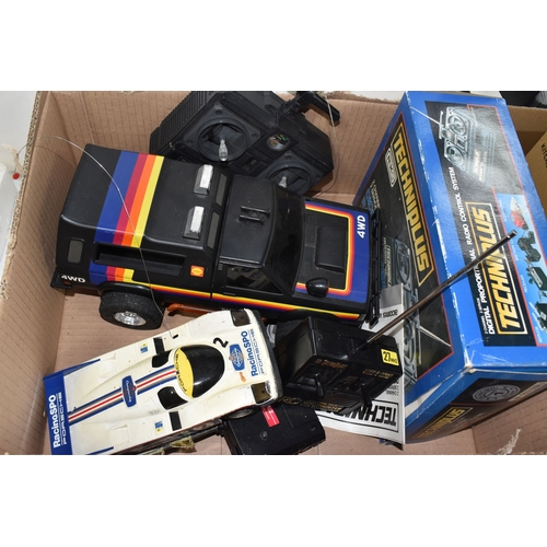 947 - THREE BOXES AND LOOSE REMOTE CONTROL CARS AND TRAINS to include a Kyosho 1:10 scale off road racing ... 