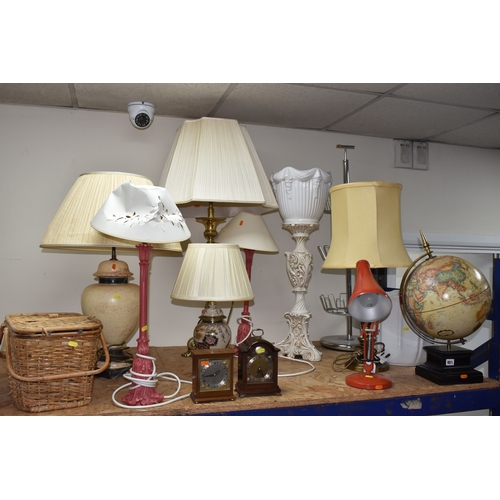 951 - A LARGE GROUP OF LAMPS AND CLOCKS, to include a tall brass lamp with shade approximately 100cm tall,... 