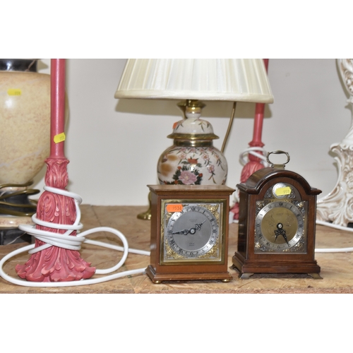 951 - A LARGE GROUP OF LAMPS AND CLOCKS, to include a tall brass lamp with shade approximately 100cm tall,... 