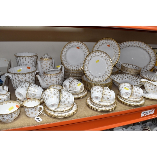 974 - A SPODE 'FLEUR DE LYS GOLD' DINNER AND TEA SERVICE comprising a tureen, a sauce boat and stand, a me... 