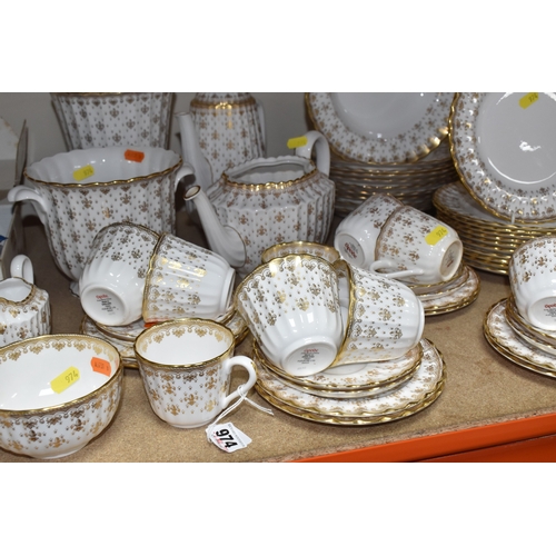 974 - A SPODE 'FLEUR DE LYS GOLD' DINNER AND TEA SERVICE comprising a tureen, a sauce boat and stand, a me... 