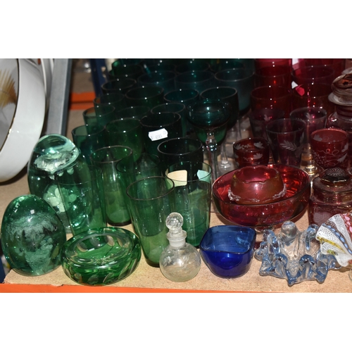 892 - A COLLECTION OF COLOURED GLASSWARE comprising two 19th century green dump paperweights (damage prese... 