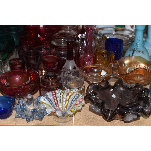 892 - A COLLECTION OF COLOURED GLASSWARE comprising two 19th century green dump paperweights (damage prese... 