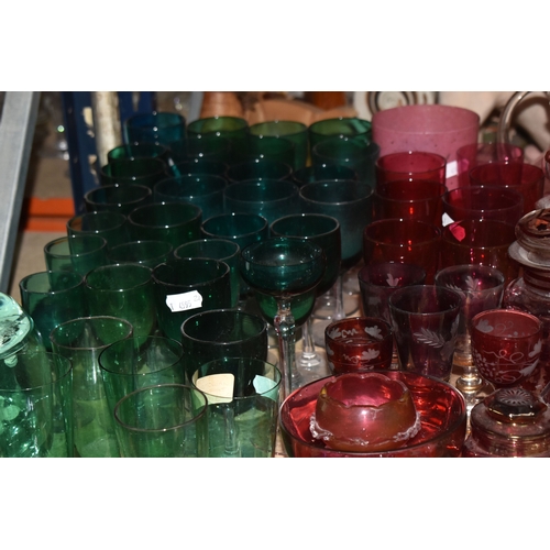 892 - A COLLECTION OF COLOURED GLASSWARE comprising two 19th century green dump paperweights (damage prese... 