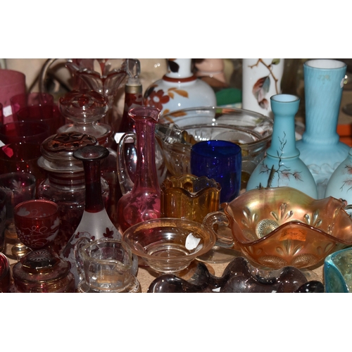 892 - A COLLECTION OF COLOURED GLASSWARE comprising two 19th century green dump paperweights (damage prese... 