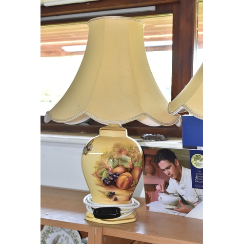 800 - A GROUP OF THREE AYNSLEY 'ORCHARD GOLD' TABLE LAMPS, comprising two matching transfer print lamps, i... 