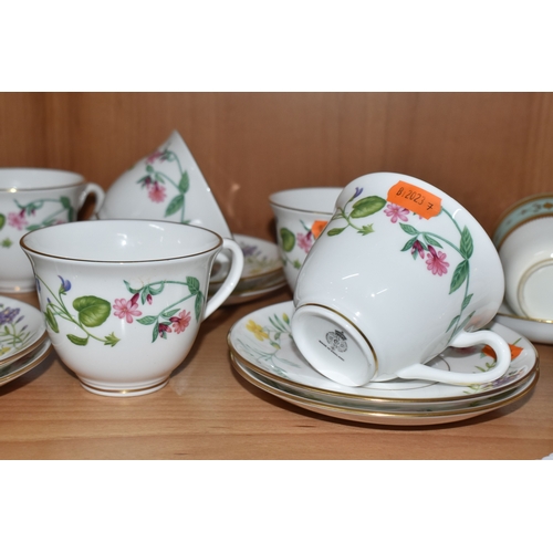 804 - A GROUP OF CERAMIC TEAWARE, comprising 19th-century Minton moulded handle cake plate, nine tea cups,... 