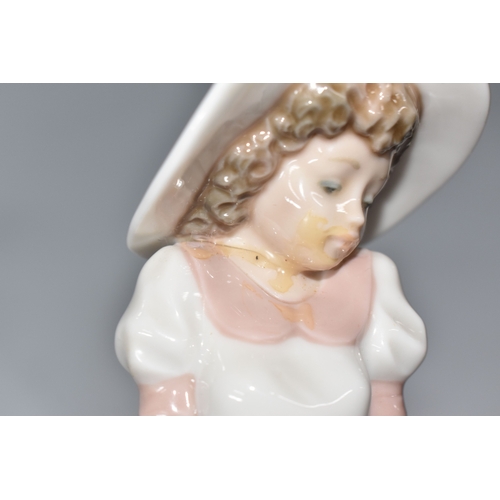 813 - THREE NAO FIGURINES, comprising 'Girl sitting with a bird', (has had noticeable restoration to the n... 
