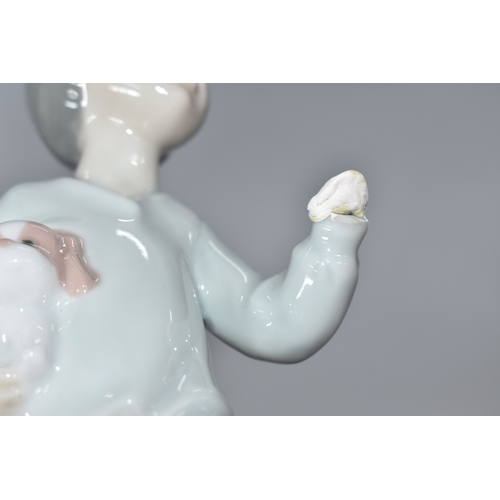 813 - THREE NAO FIGURINES, comprising 'Girl sitting with a bird', (has had noticeable restoration to the n... 