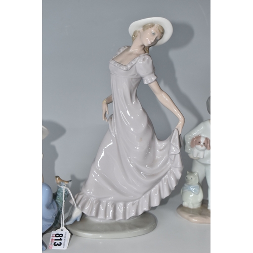 813 - THREE NAO FIGURINES, comprising 'Girl sitting with a bird', (has had noticeable restoration to the n... 