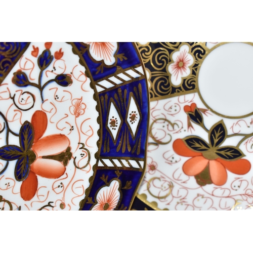 814 - FOUR PIECES OF ROYAL CROWN DERBY IMARI 2451, comprising a 21.5cm plate, an 18cm plate, a teacup and ... 