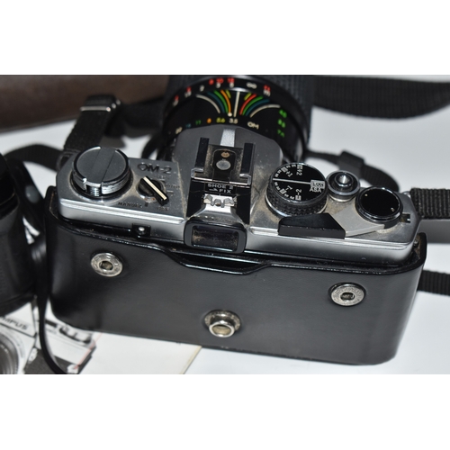 835 - TWO OLYMPUS CAMERAS, comprising an Olympus OM-2 fitted with a Sirius f3.5-4.5 28-70mm lens, and an O... 