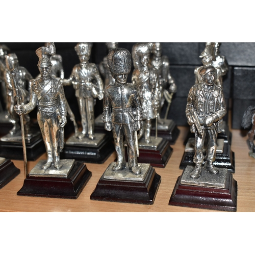 799 - A GROUP OF METAL VINTAGE SOLDIER FIGURES, comprising sixteen miniature silver plated Royal Hampshire... 