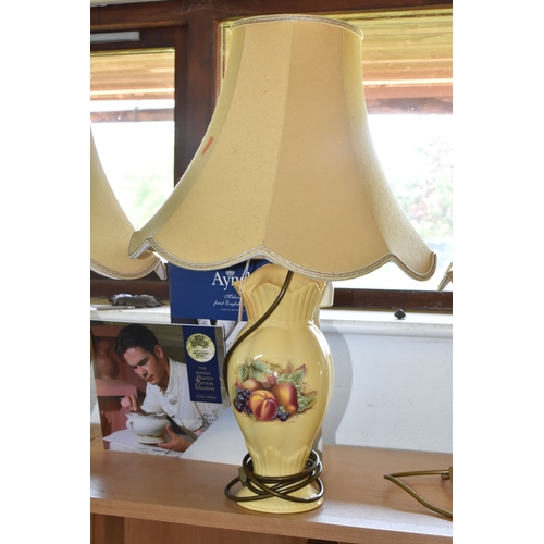 800 - A GROUP OF THREE AYNSLEY 'ORCHARD GOLD' TABLE LAMPS, comprising two matching transfer print lamps, i... 