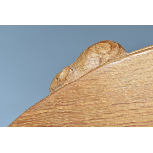 801 - A ROBERT MOUSEMAN THOMPSON OAK BOOK SHELF, single shelf with shaped adzed ends, carved with signatur... 