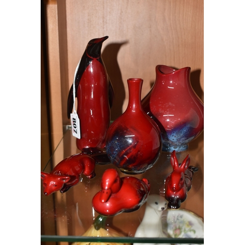 807 - A GROUP OF ROYAL DOULTON FLAMBE VASES AND FIGURES, comprising figures of a penguin, height 15.5cm (s... 