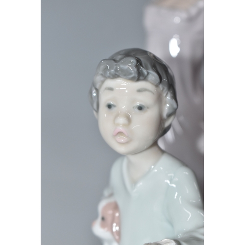813 - THREE NAO FIGURINES, comprising 'Girl sitting with a bird', (has had noticeable restoration to the n... 