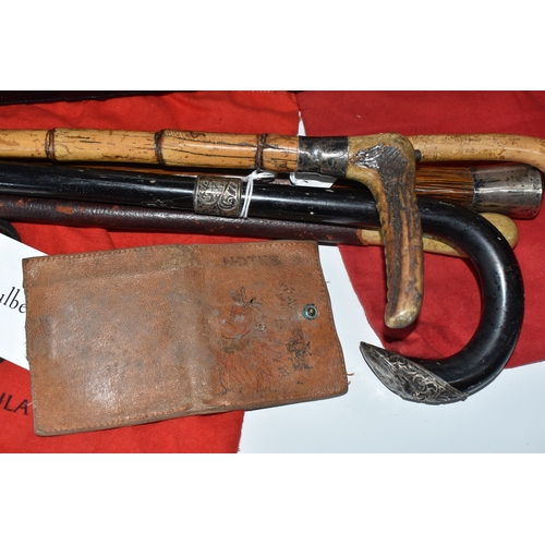 823 - A BOX AND LOOSE HANDBAGS AND WALKING STICKS, to include four walking sticks, including one with silv... 