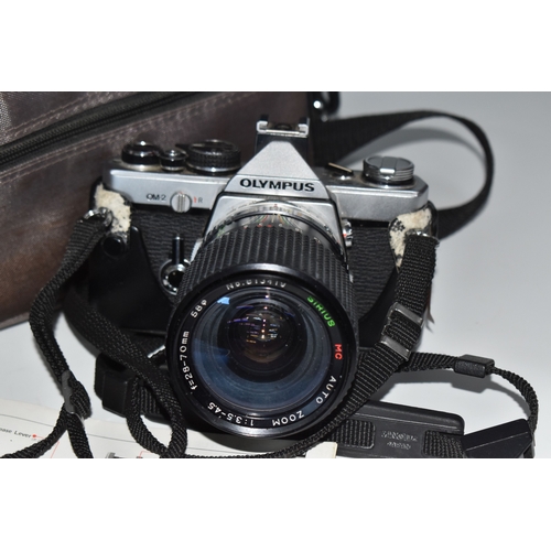 835 - TWO OLYMPUS CAMERAS, comprising an Olympus OM-2 fitted with a Sirius f3.5-4.5 28-70mm lens, and an O... 