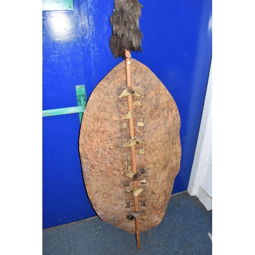 843 - AN AFRICAN ZULU STYLE SHIELD of traditional elongated oval form, constructed from animal hide with r... 