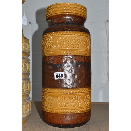 846 - TWO LARGE FLOOR STANDING WEST GERMAN VASES, the first is of tubular form with handle in beige with i... 