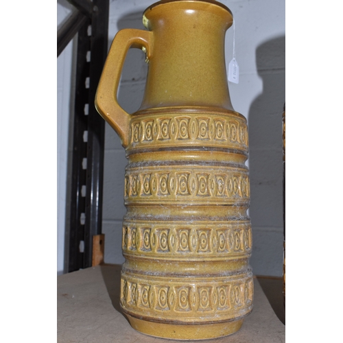846 - TWO LARGE FLOOR STANDING WEST GERMAN VASES, the first is of tubular form with handle in beige with i... 