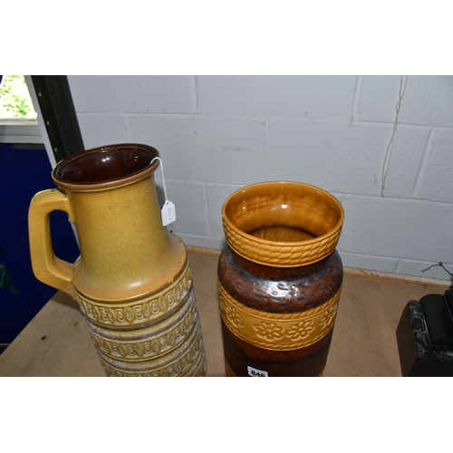 846 - TWO LARGE FLOOR STANDING WEST GERMAN VASES, the first is of tubular form with handle in beige with i... 