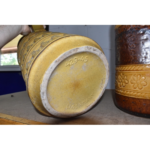 846 - TWO LARGE FLOOR STANDING WEST GERMAN VASES, the first is of tubular form with handle in beige with i... 